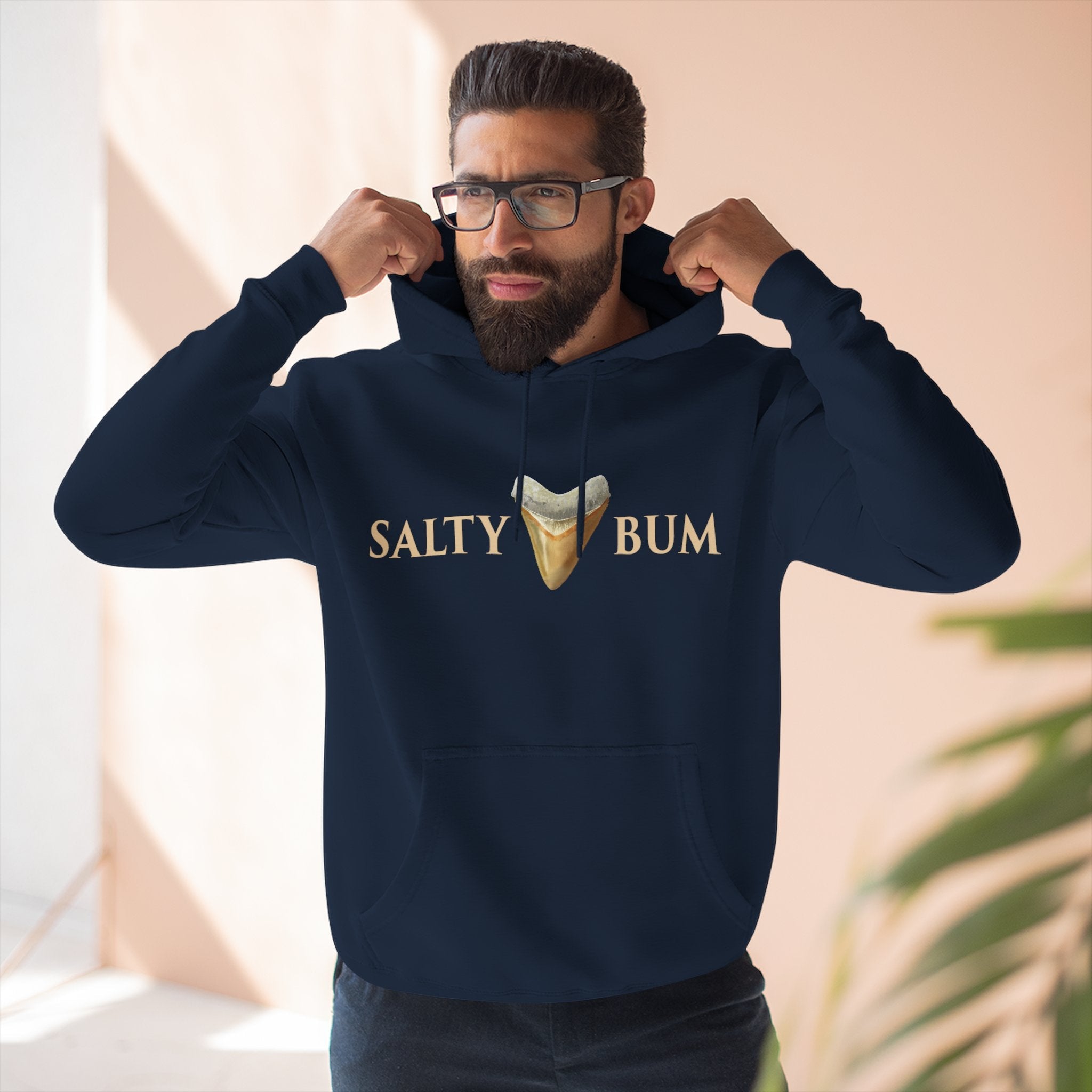 man in navy meg hoodie
