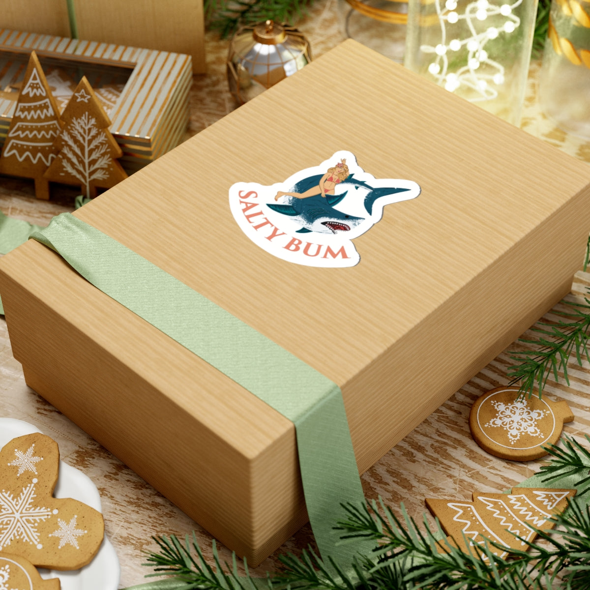 Wooden gift box with a 'Salty Bum' logo on a festive background with cookies and greenery.