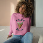 Person wearing a pink hoodie with 'Salty Bum' text and ice cream graphic.