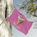 Pink flag with a shark tooth graphic and 'Salty Bum' text, waving in the wind.