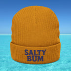 Orange beanie with 'Salty Bum' text on a blue water and sky background