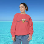 Person wearing a red sweatshirt with 'Salty Bum' text and ice cream graphic against a blue ocean background