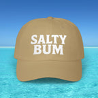 Brown cap with 'Salty Bum' text on a beach background