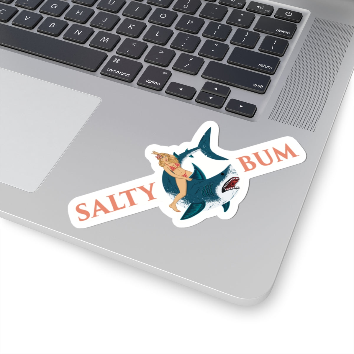 Sticker with a shark and woman design on a laptop