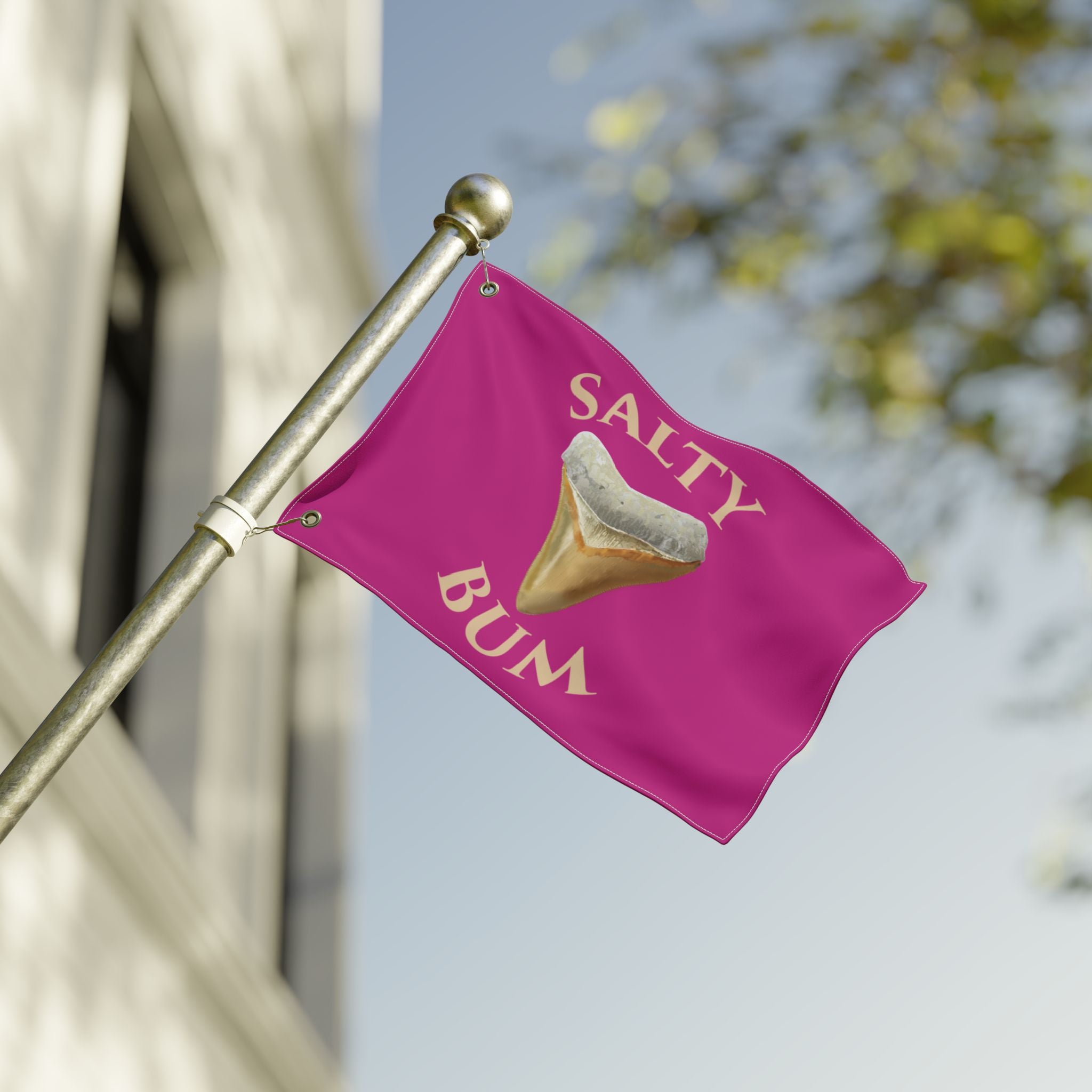 Pink flag with 'Salty Bum' text and a tooth graphic on a blurred background