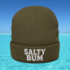 Brown beanie with 'Salty Bum' text on a blue water and sky background