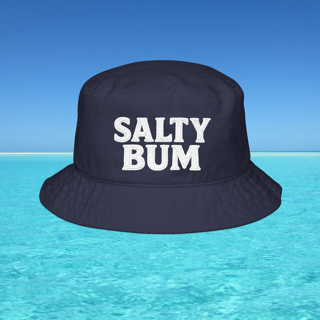 Navy bucket hat with 'Salty Bum' text on a clear blue water background