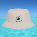 Beige bucket hat with 'Salty Bum' logo on a blue water and sky background