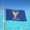 Flag with 'Salty Bum' text and a shark tooth graphic against a blue sky and ocean background.