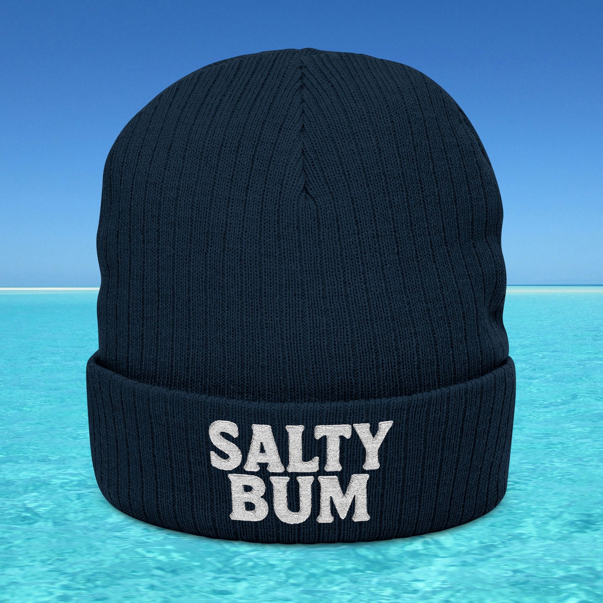 Black beanie with 'Salty Bum' text on a blue water background