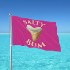 Flag with 'Salty Bum' text and a tooth graphic against a blue ocean and sky background