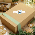Wooden gift box with a green ribbon and 'Salty Bum' sticker on a festive background with cookies and lights.