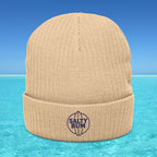 Beige beanie with 'Salty Bum' logo on a blue water background