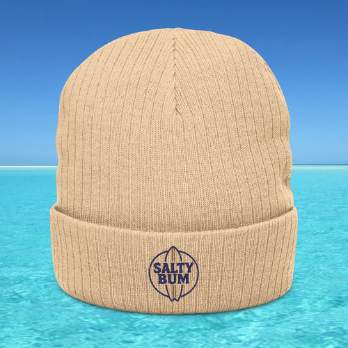Beige beanie with 'Salty Bum' logo on a blue water background
