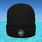 Black beanie with 'Salty Bum' logo on a blue water background