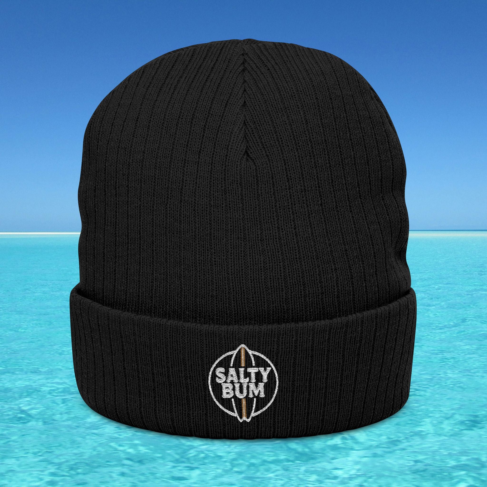 Black beanie with 'Salty Bum' logo on a blue water background