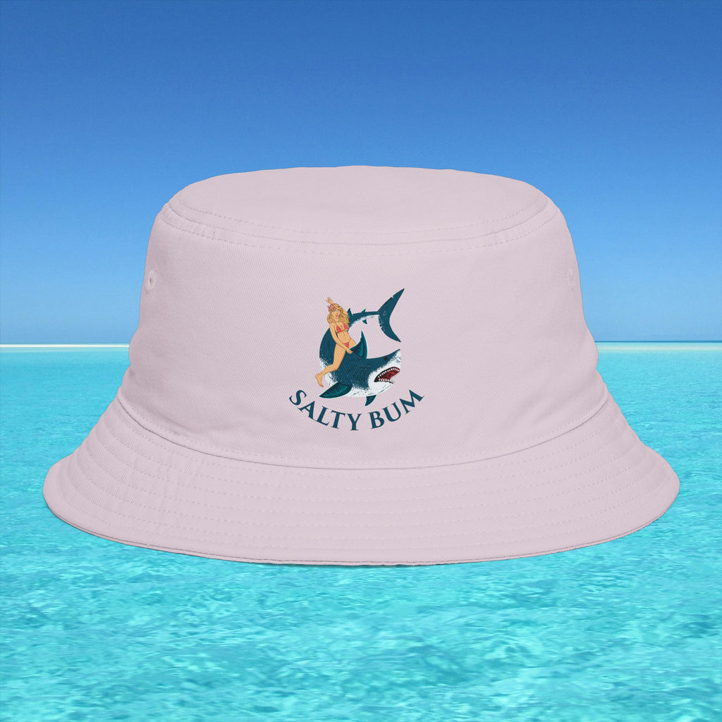 Pink bucket hat with 'Salty Bum' logo on a clear blue water and sky background