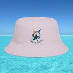 Pink bucket hat with 'Salty Bum' logo on a clear blue water and sky background