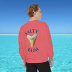 Person wearing a pink sweatshirt with 'Salty Bum' text and ice cream cone graphic, standing in front of a blue ocean.