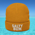 Orange beanie with 'Salty Bum' text on a blue water and sky background